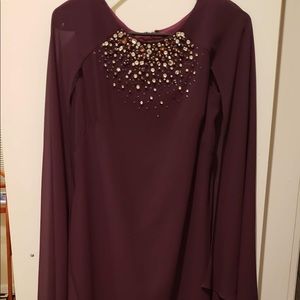 Woman’s maroon Vince Camuto dress